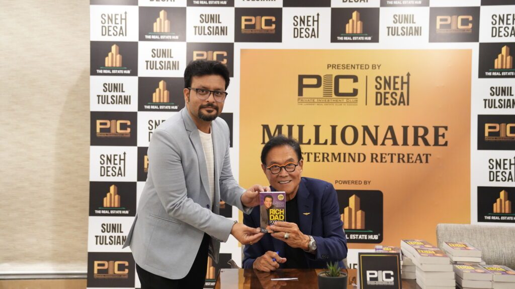 Pradeep Rawal with Robert Kiyosaki at a Rich Dad Poor Dad book signing